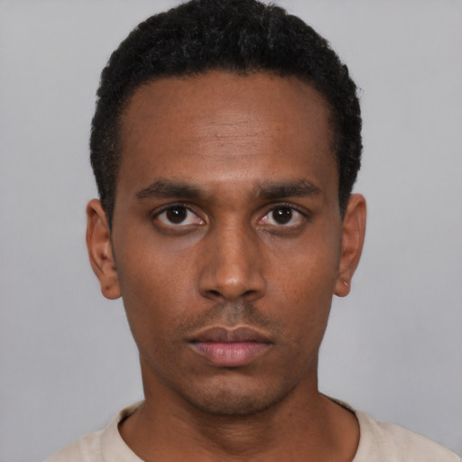 Neutral latino young-adult male with short  black hair and brown eyes