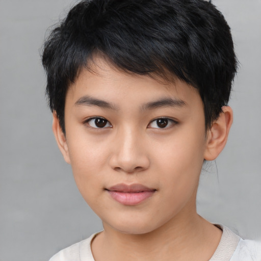 Joyful asian child female with short  black hair and brown eyes