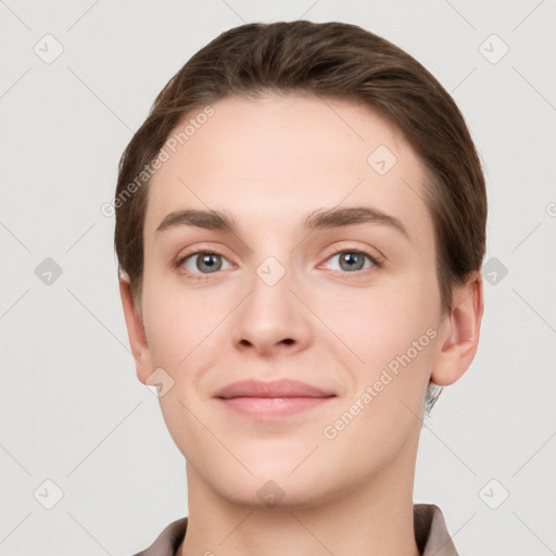 Joyful white young-adult female with short  brown hair and grey eyes