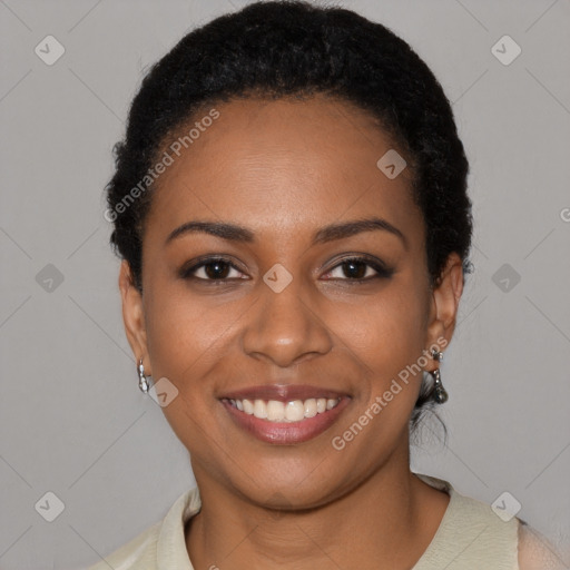 Joyful black young-adult female with short  black hair and brown eyes