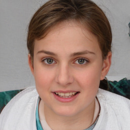 Joyful white young-adult female with medium  brown hair and blue eyes