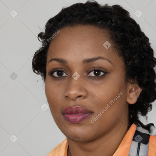 Joyful black young-adult female with medium  black hair and brown eyes