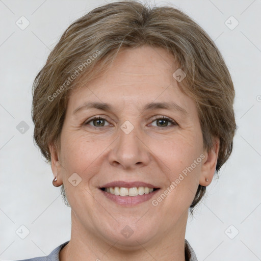 Joyful white adult female with short  brown hair and grey eyes