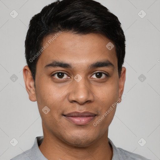 Joyful latino young-adult male with short  black hair and brown eyes