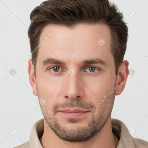 Neutral white young-adult male with short  brown hair and grey eyes