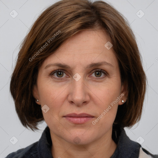 Joyful white adult female with medium  brown hair and grey eyes