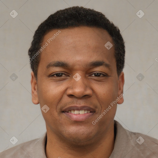 Joyful latino young-adult male with short  brown hair and brown eyes