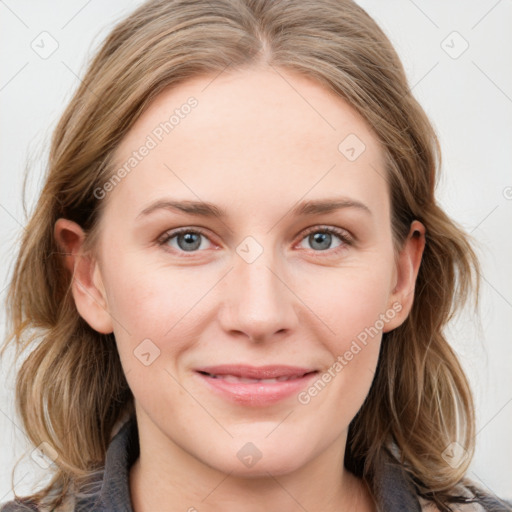 Joyful white young-adult female with medium  brown hair and blue eyes