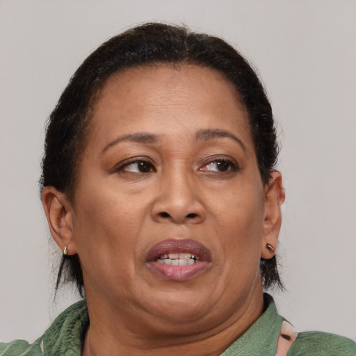 Joyful asian adult female with short  brown hair and brown eyes