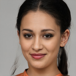 Joyful latino young-adult female with medium  brown hair and brown eyes