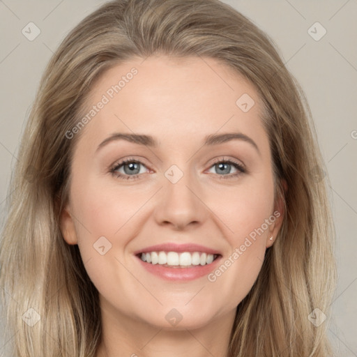 Joyful white young-adult female with long  brown hair and grey eyes