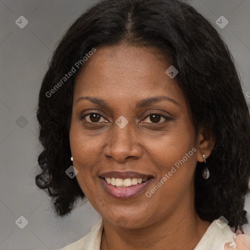 Joyful black adult female with medium  brown hair and brown eyes