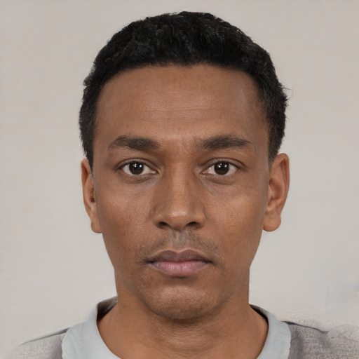 Neutral black young-adult male with short  black hair and brown eyes