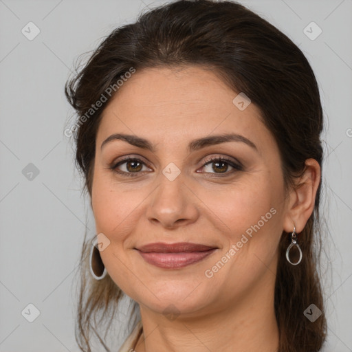 Joyful white adult female with medium  brown hair and brown eyes