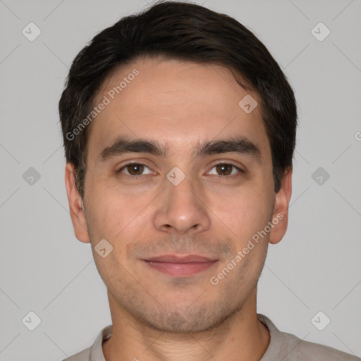 Joyful white young-adult male with short  black hair and brown eyes