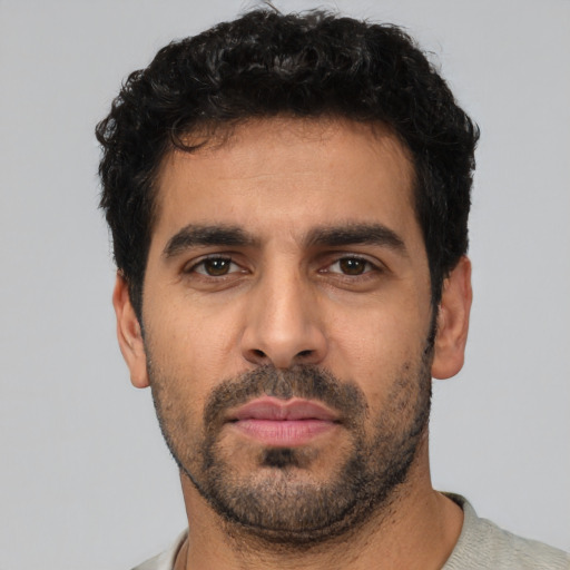 Neutral white young-adult male with short  black hair and brown eyes