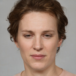 Joyful white adult female with short  brown hair and grey eyes