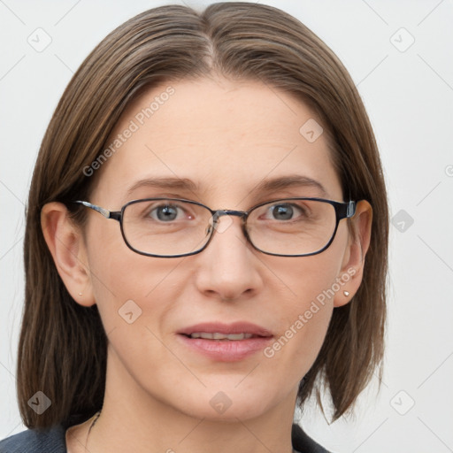 Joyful white adult female with medium  brown hair and grey eyes