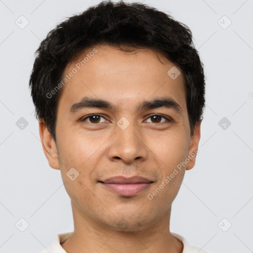 Joyful latino young-adult male with short  brown hair and brown eyes