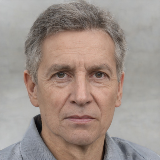 Neutral white middle-aged male with short  gray hair and brown eyes