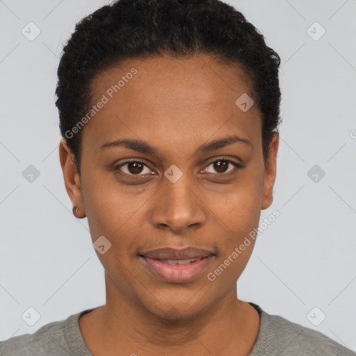 Joyful black young-adult female with short  black hair and brown eyes