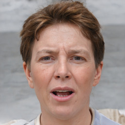 Joyful white adult female with short  brown hair and brown eyes