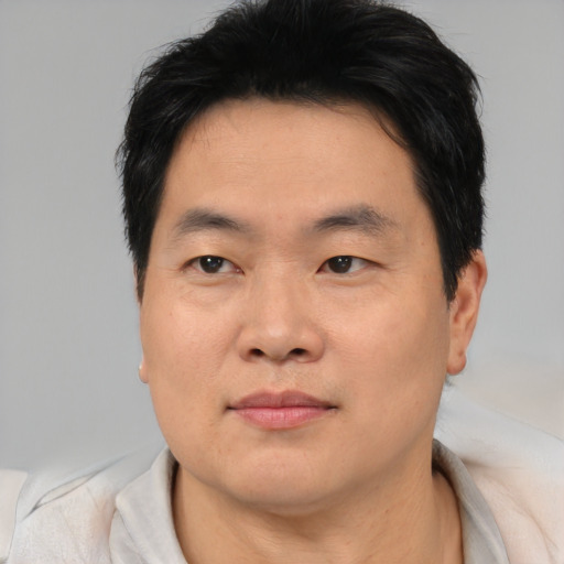 Neutral asian young-adult male with short  brown hair and brown eyes