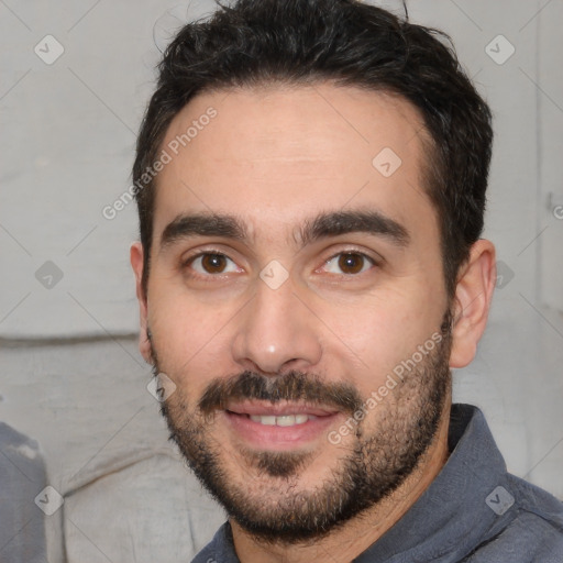 Joyful white young-adult male with short  black hair and brown eyes