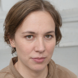 Neutral white young-adult female with medium  brown hair and grey eyes