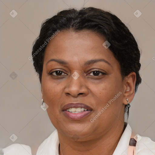 Joyful black adult female with short  brown hair and brown eyes