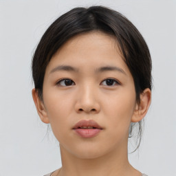 Neutral asian young-adult female with medium  brown hair and brown eyes