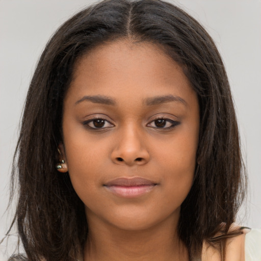 Neutral black young-adult female with long  brown hair and brown eyes