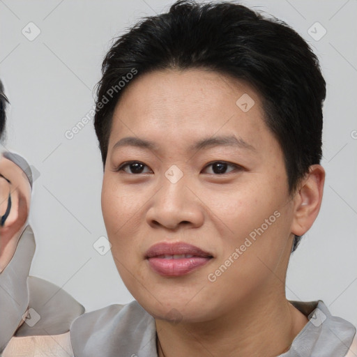 Joyful asian young-adult female with short  brown hair and brown eyes
