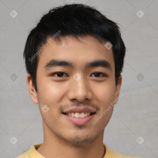 Joyful asian young-adult male with short  black hair and brown eyes