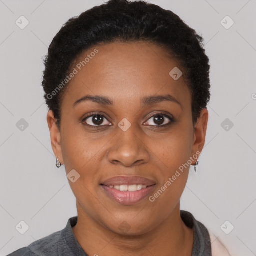 Joyful black young-adult female with short  black hair and brown eyes