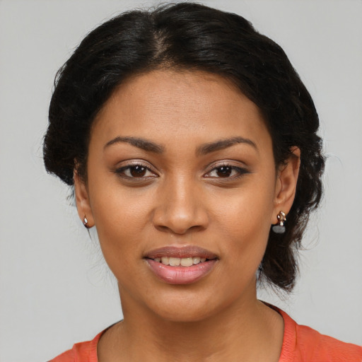 Joyful latino young-adult female with medium  black hair and brown eyes