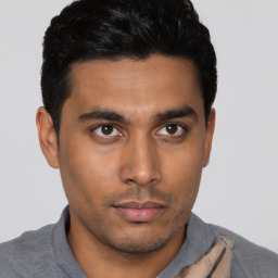 Neutral latino young-adult male with short  black hair and brown eyes