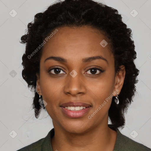 Joyful black young-adult female with long  black hair and brown eyes