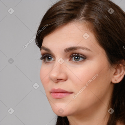 Neutral white young-adult female with medium  brown hair and brown eyes