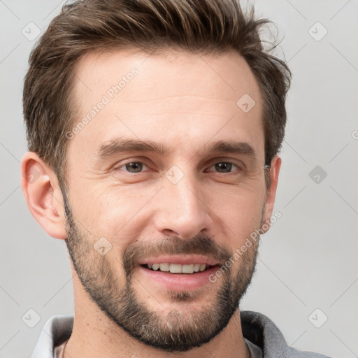 Joyful white adult male with short  brown hair and brown eyes