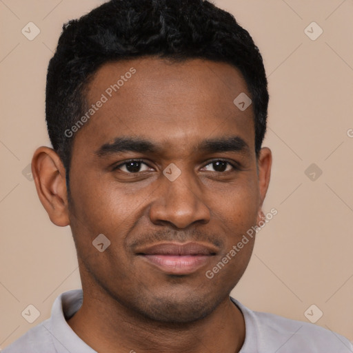 Joyful black young-adult male with short  black hair and brown eyes