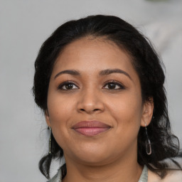 Joyful latino young-adult female with medium  black hair and brown eyes