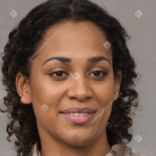 Joyful black adult female with medium  brown hair and brown eyes