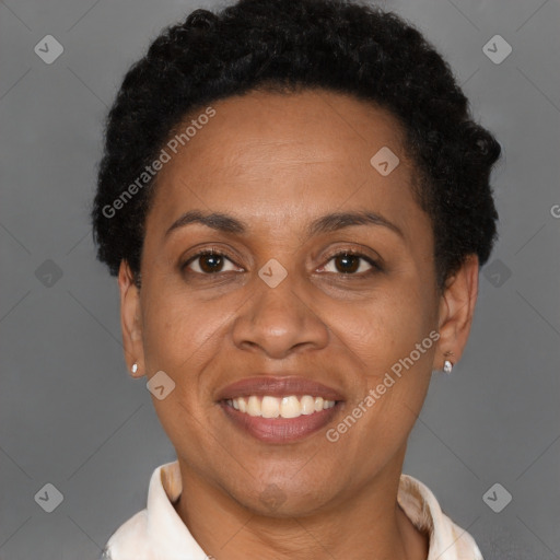 Joyful latino adult female with short  brown hair and brown eyes