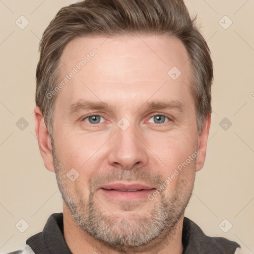 Joyful white adult male with short  brown hair and grey eyes