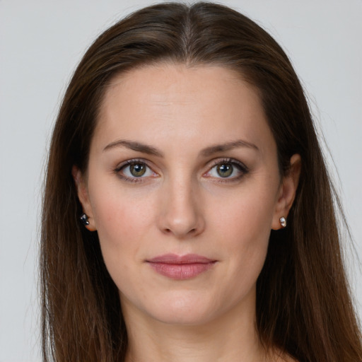 Joyful white young-adult female with long  brown hair and grey eyes