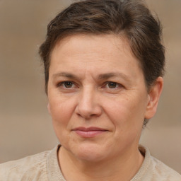 Joyful white adult female with short  brown hair and brown eyes