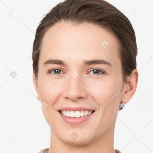 Joyful white young-adult female with short  brown hair and brown eyes