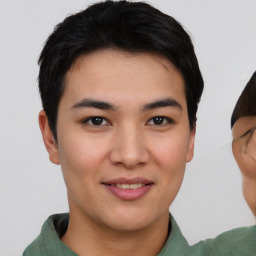 Joyful asian young-adult male with short  brown hair and brown eyes