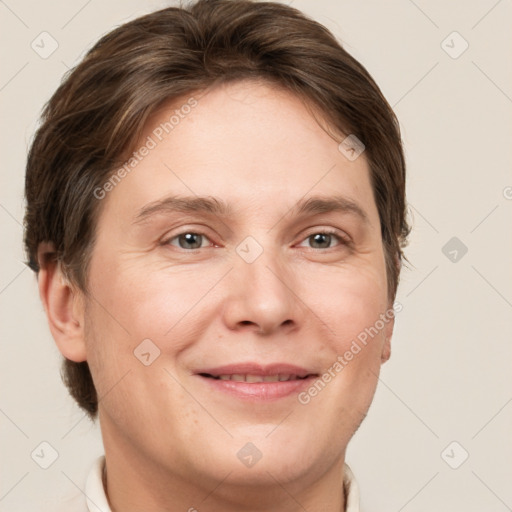 Joyful white adult female with short  brown hair and grey eyes